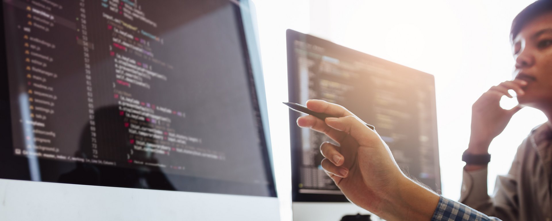 Developing programming and coding technologies working in a software engineers developing applications together in office. Developing programming and coding technologies working in a software engineers developing applications together in office.