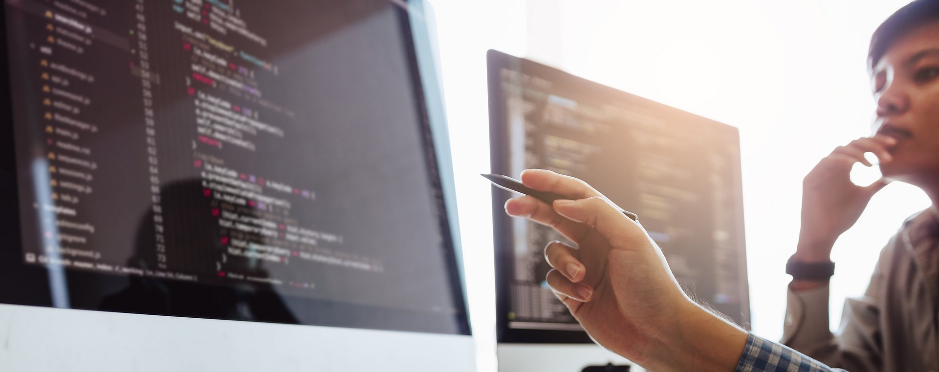 Developing programming and coding technologies working in a software engineers developing applications together in office. Developing programming and coding technologies working in a software engineers developing applications together in office.